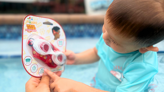 Child looking at Frogglez Goggles Daniel Tiger's Neighborhood swim goggles for kids 3-10. best swim gear for kids