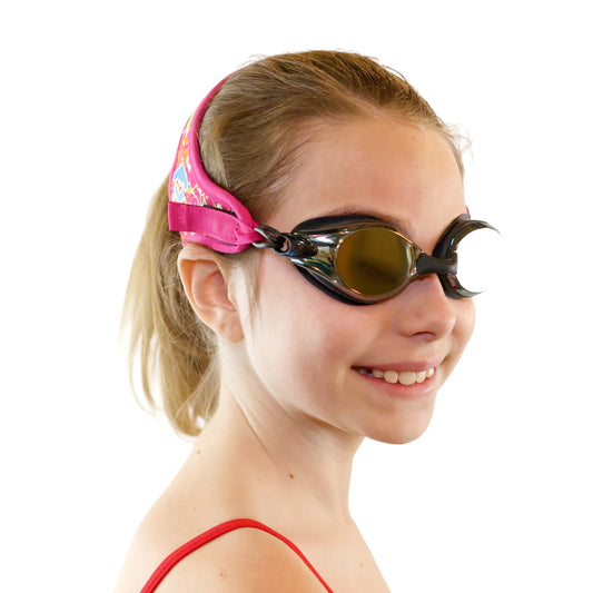 Teen and adult style swim goggles with an abstract pink and orange pattern