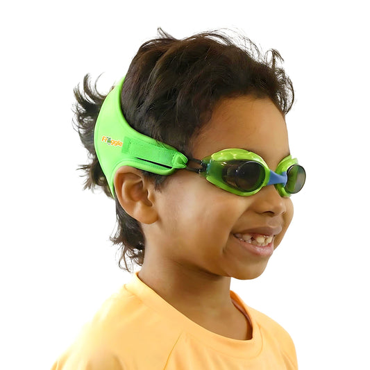 Child wearing green frogglez swim goggles ages 3-10 green solid strap split design adjustable grow with your child